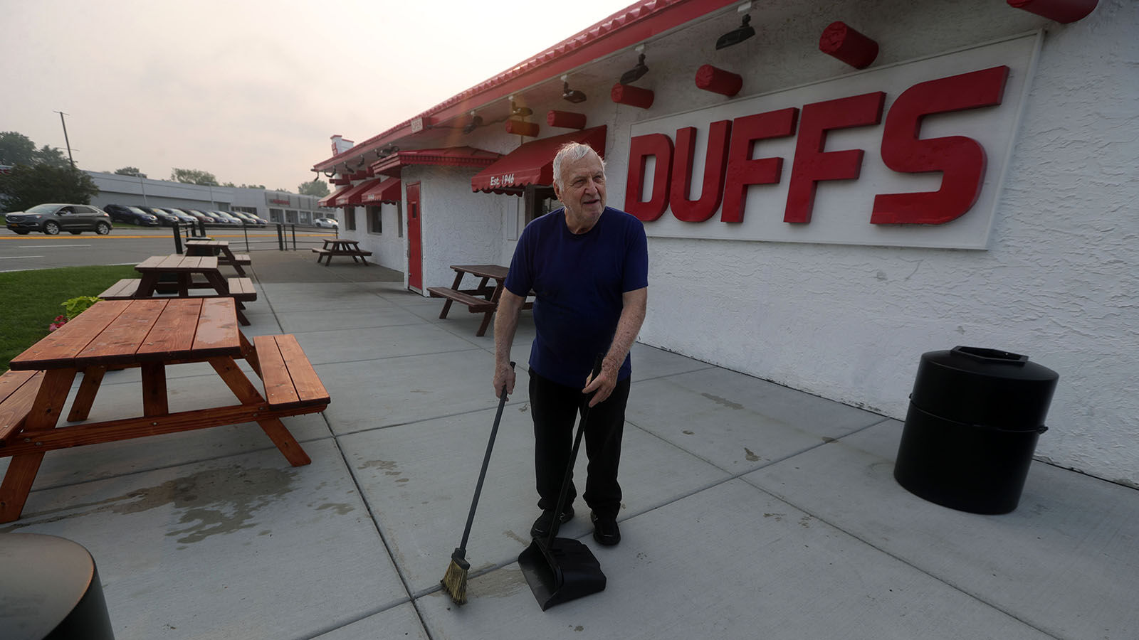 Ron Duff cleans patio at Duff's